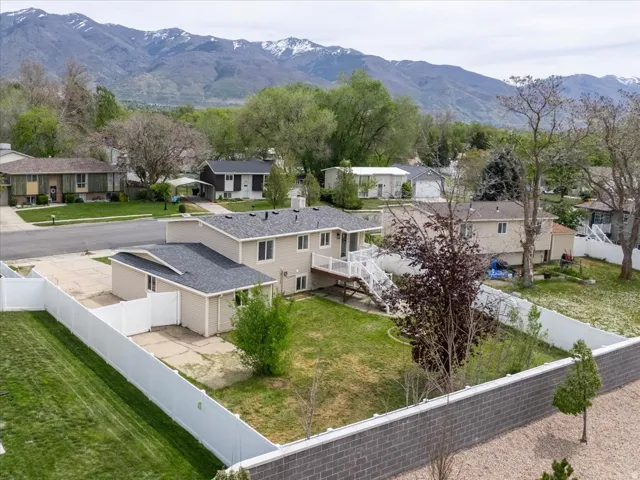 Aerial view of residential area featuring mountains