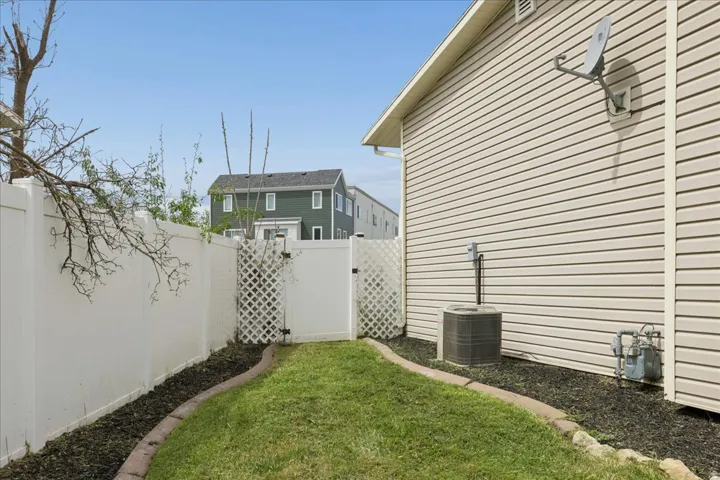 Fenced yard featuring a gate
