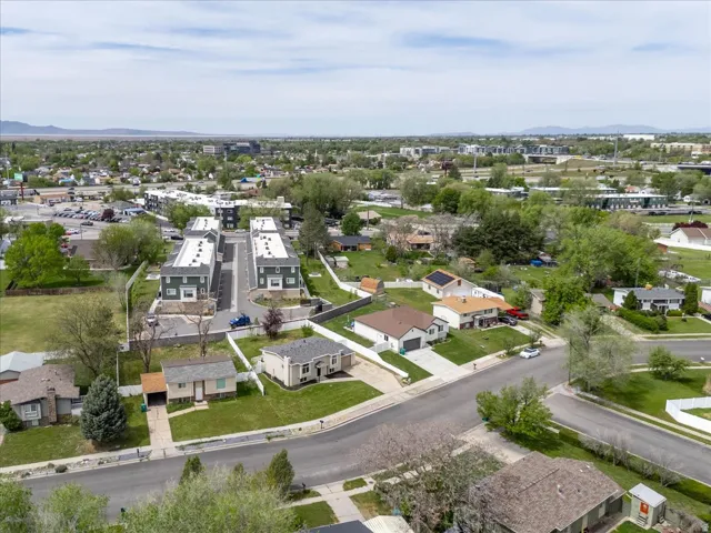 Aerial perspective of suburban area featuring a mountainous background