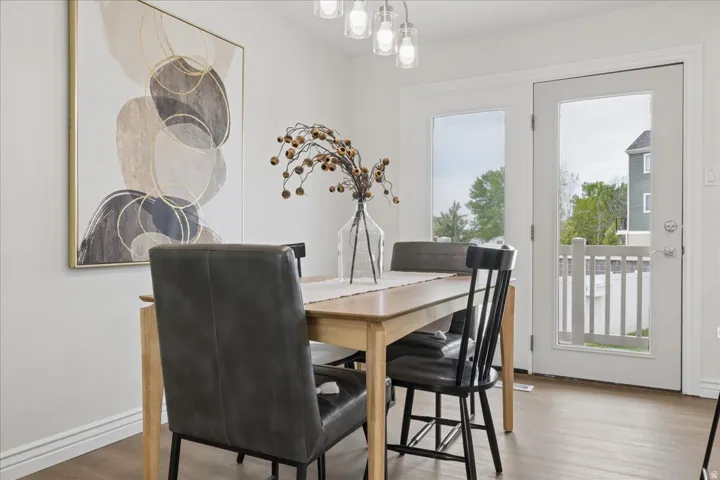 Dining space featuring wood finished floors and baseboards