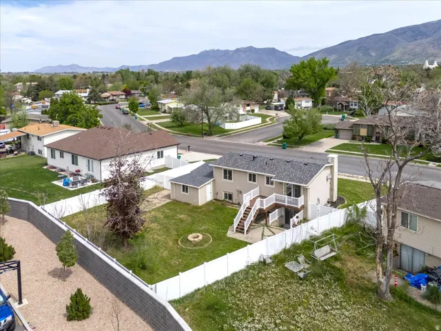 Aerial view of residential area featuring a mountain backdrop