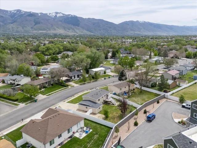Aerial view of residential area with a mountainous background