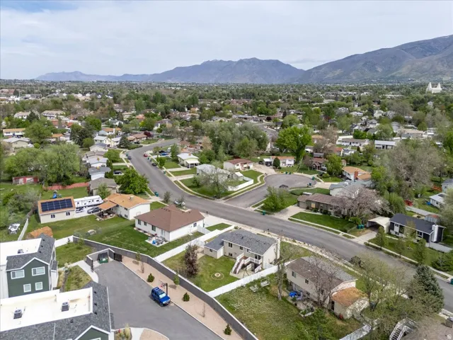 Aerial perspective of suburban area with a mountain backdrop