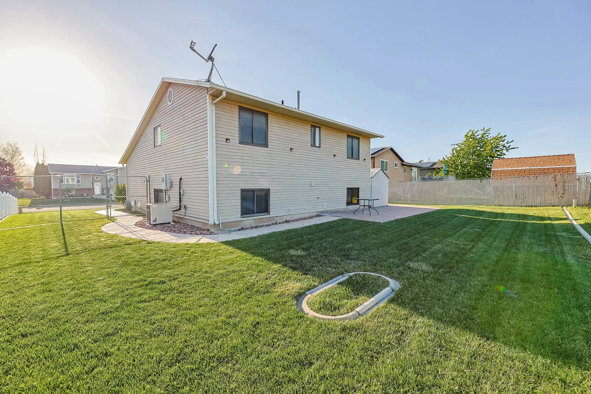 Back of house featuring a fenced backyard and a patio area