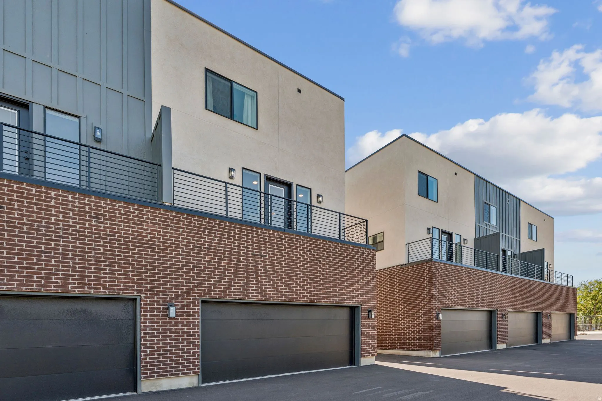 View of apartment building / complex featuring an attached garage
