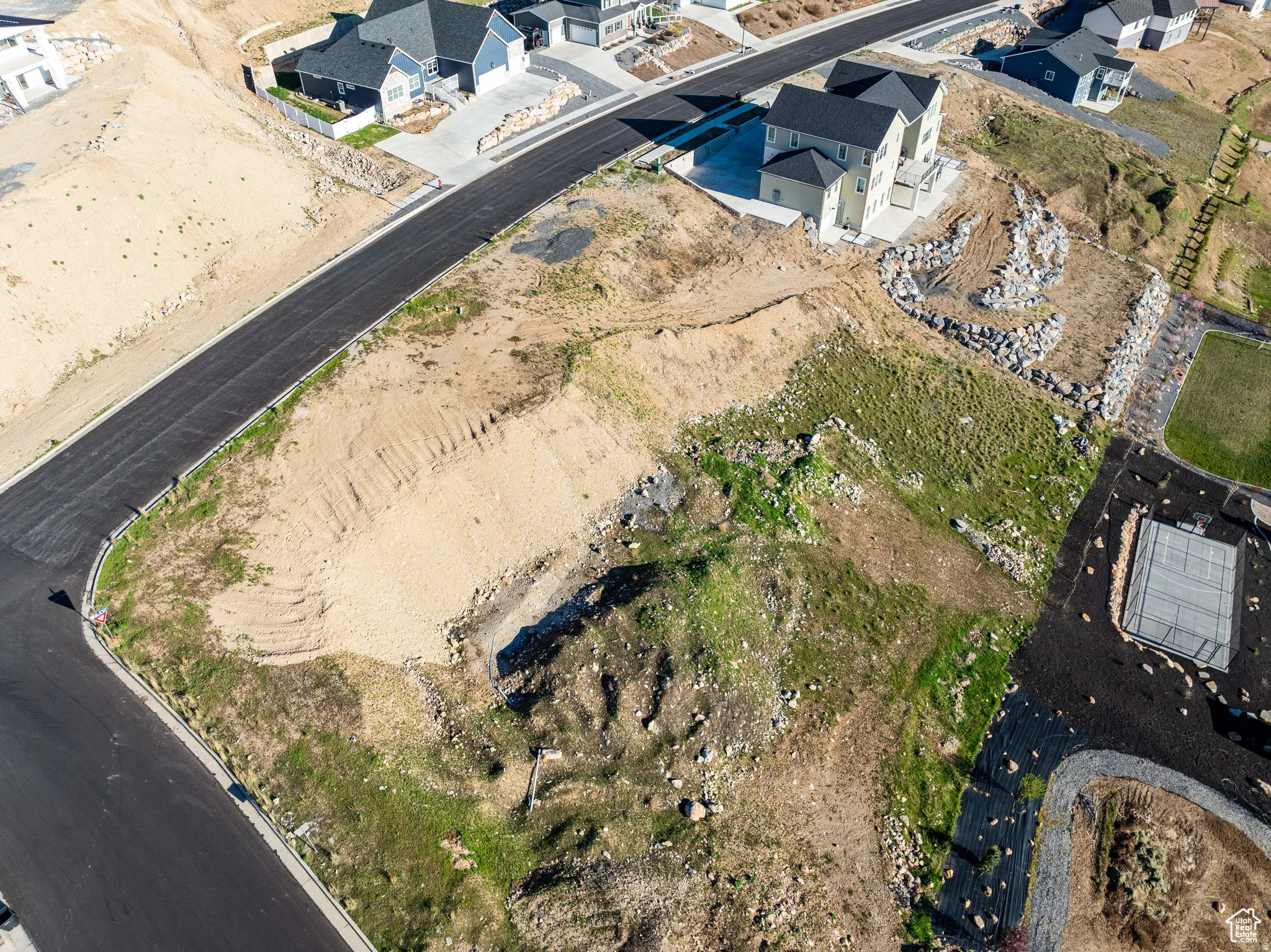Aerial view of property's location featuring nearby suburban area