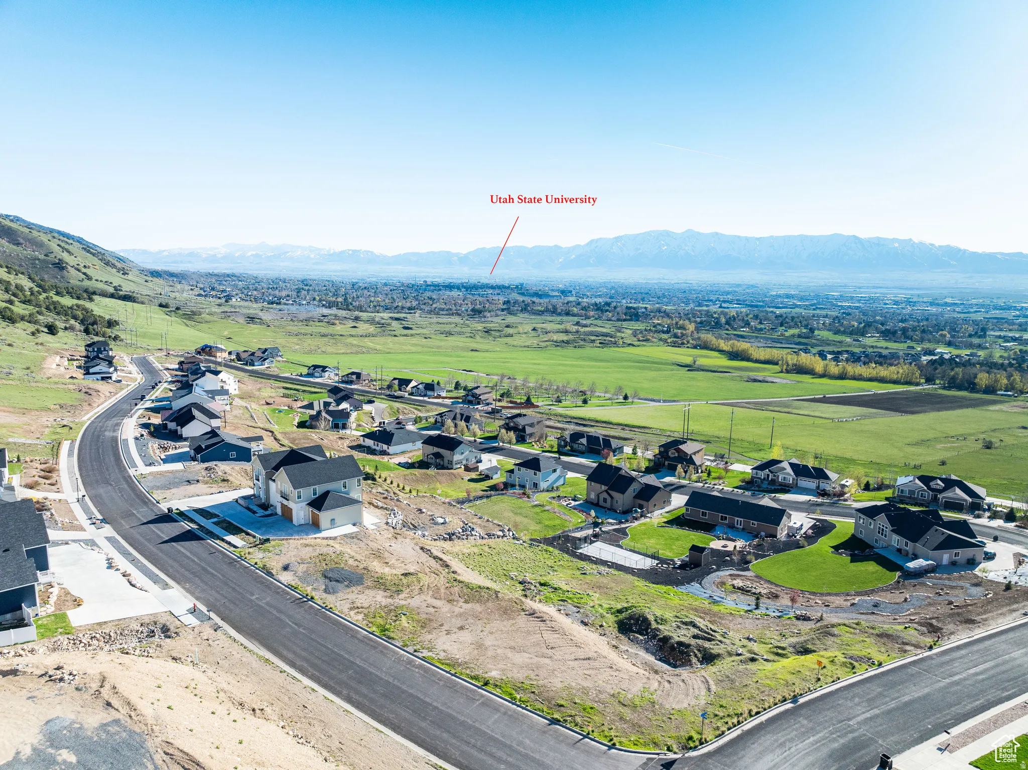 Aerial perspective of suburban area with a mountainous background