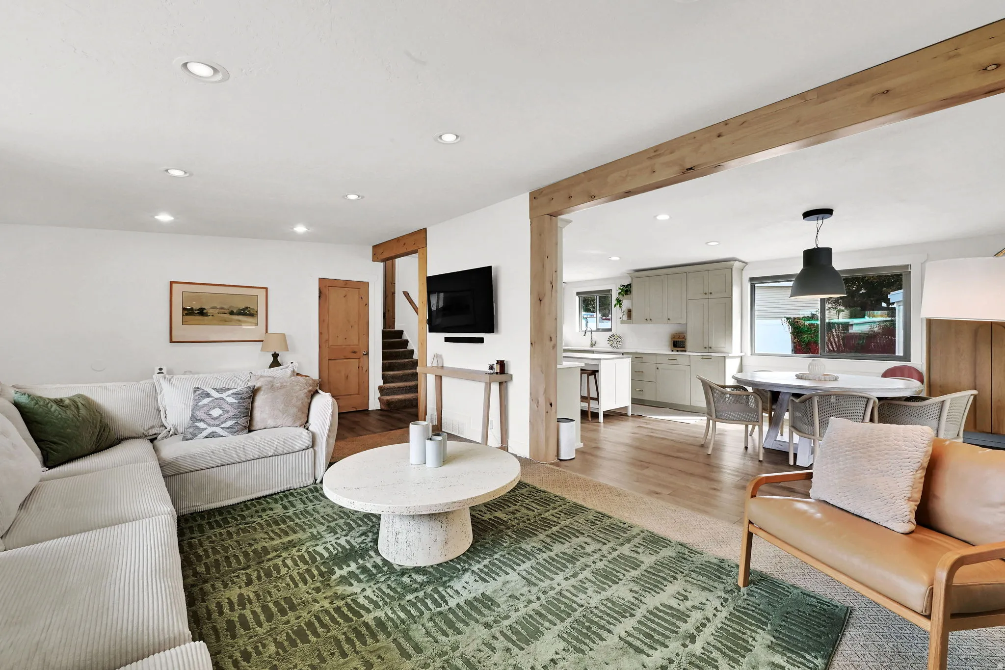 Living area featuring recessed lighting, stairway, and wood finished floors