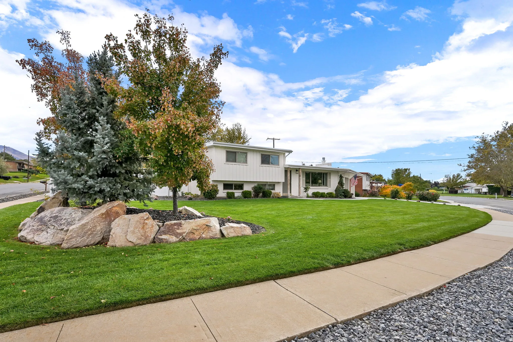 Tri-level home with a front lawn