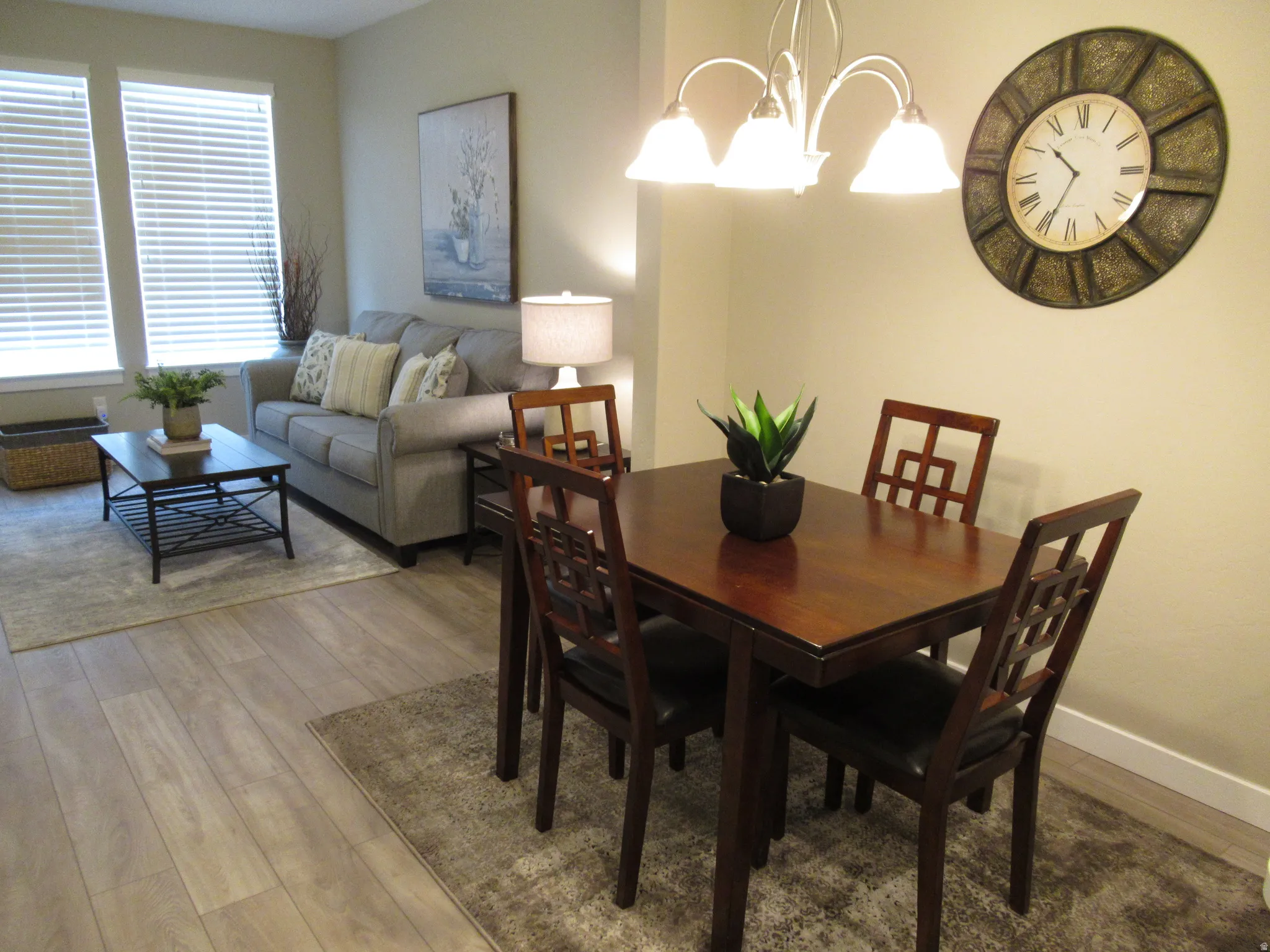 Dining area featuring a chandelier and wood finished floors