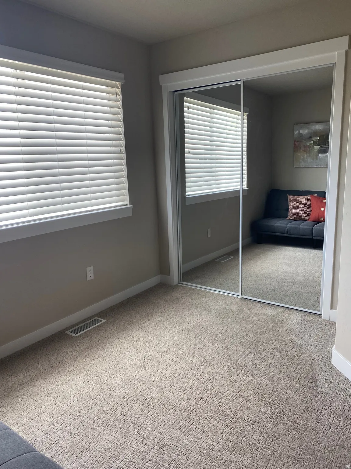 Unfurnished bedroom featuring a closet and carpet floors