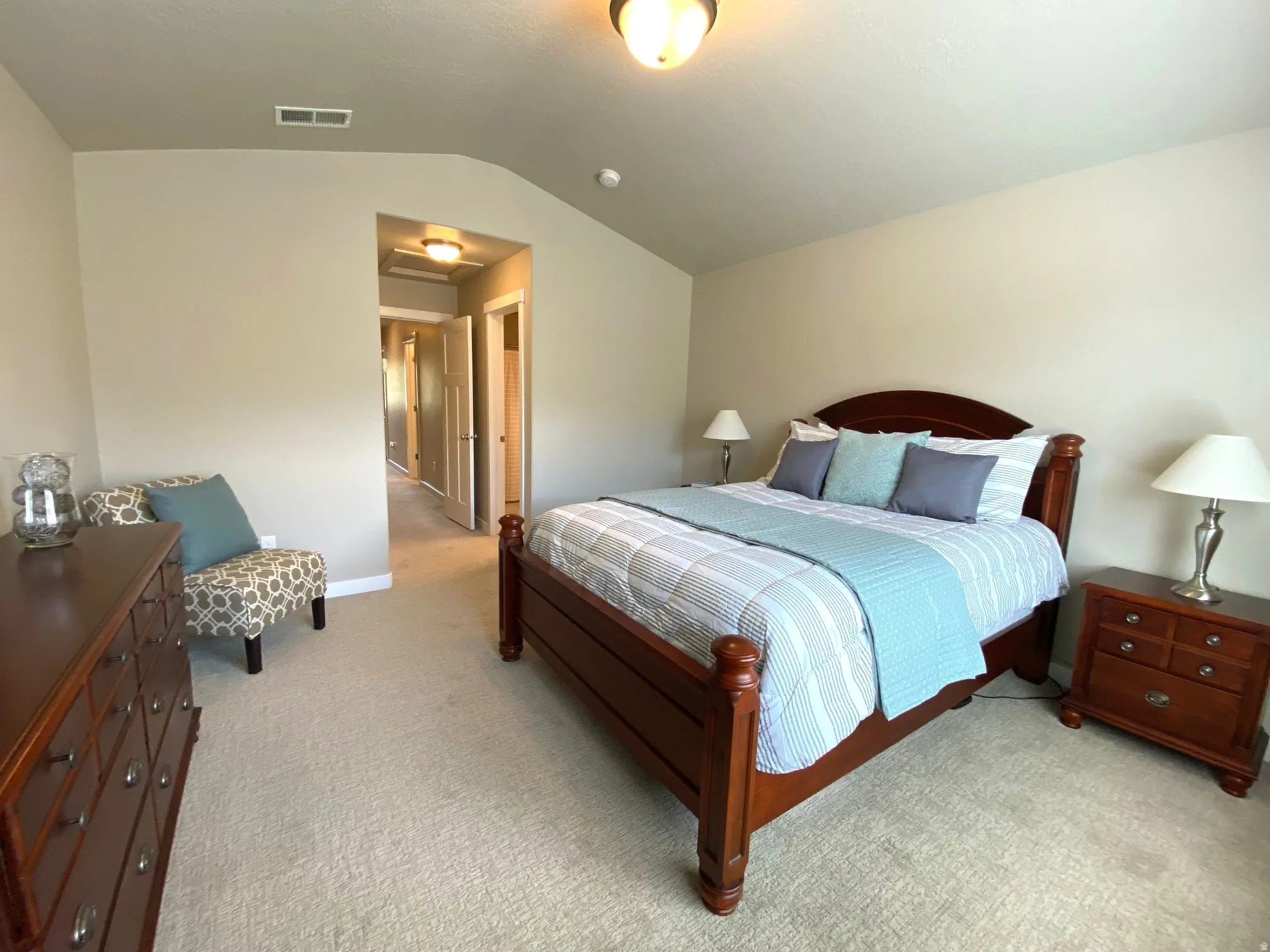 Bedroom featuring light colored carpet and baseboards