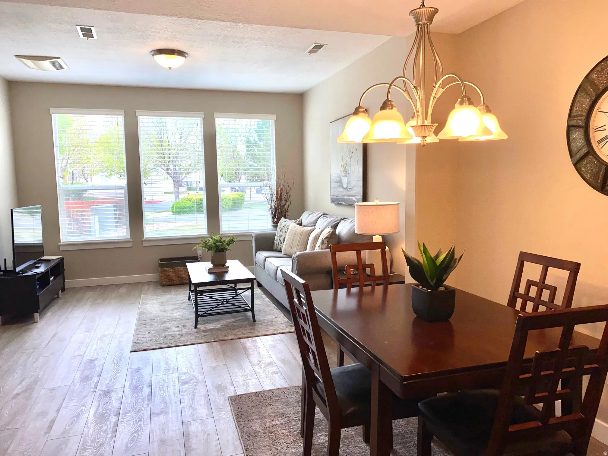 Dining room featuring light wood-style floors and a chandelier