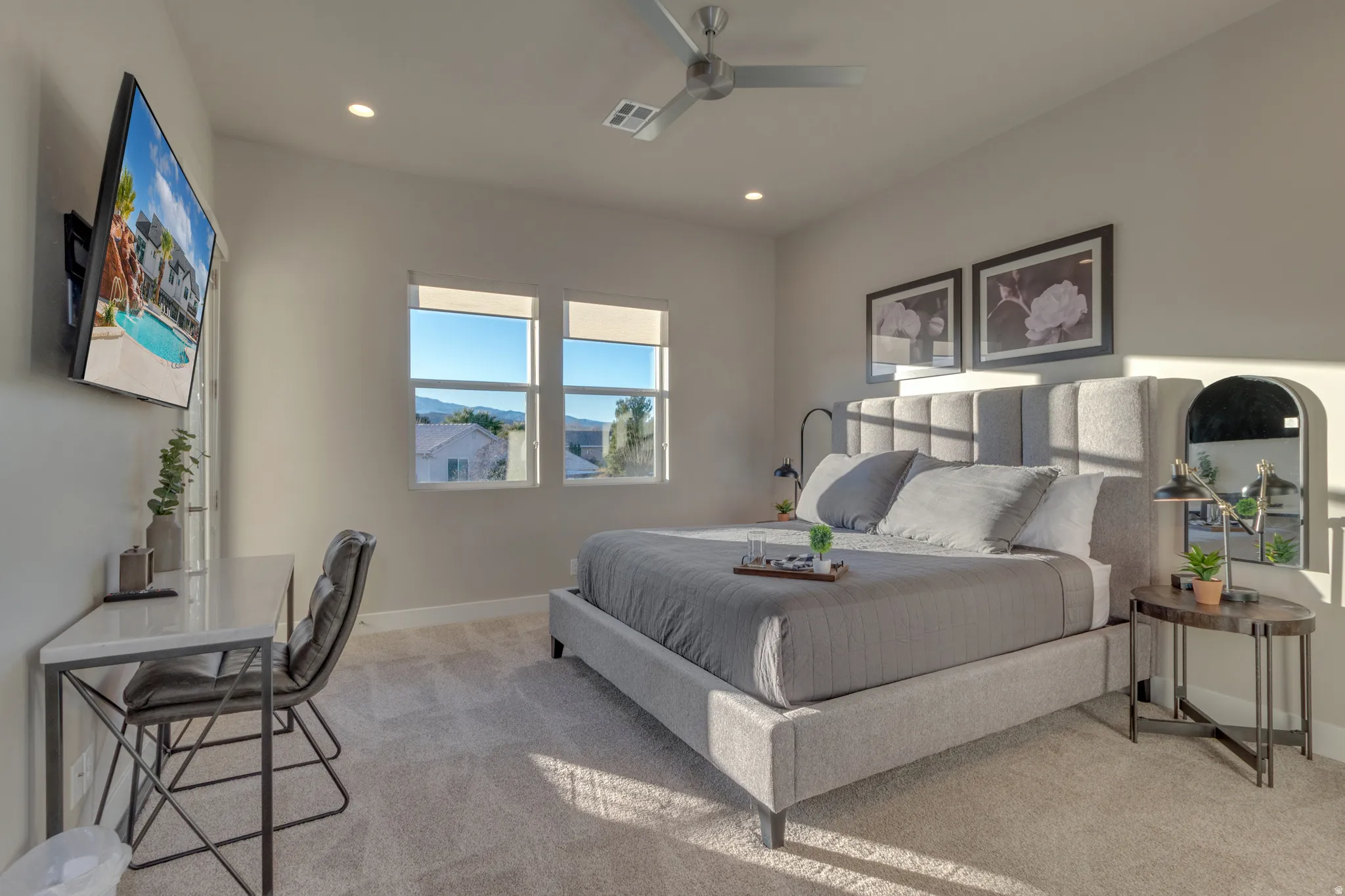 Bedroom featuring light carpet, a ceiling fan, and recessed lighting