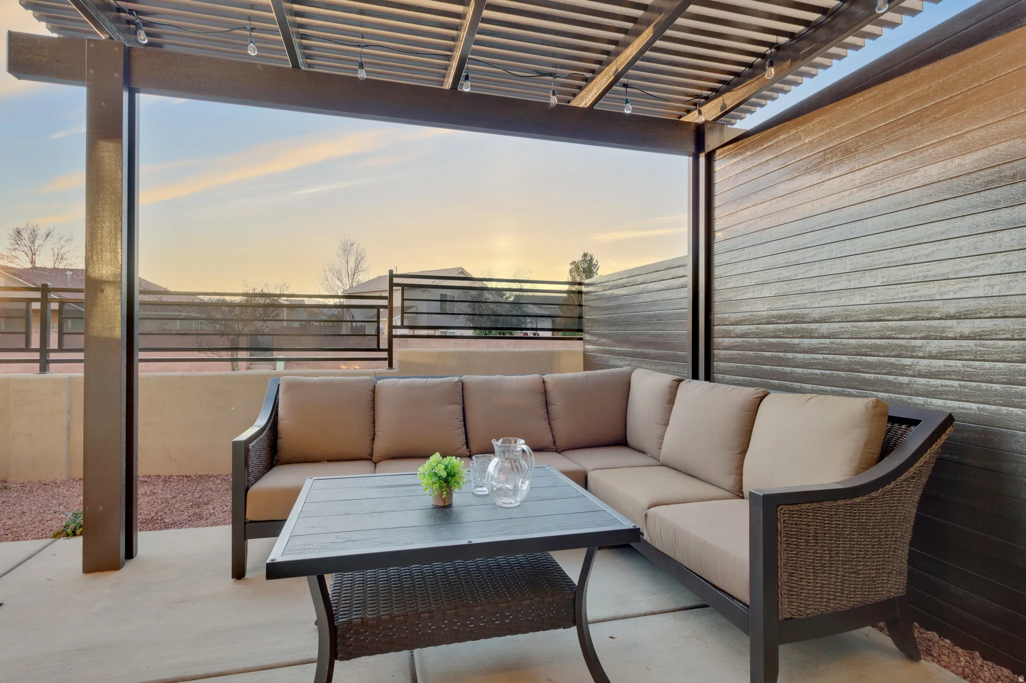 Patio terrace at dusk featuring a pergola, a patio, and outdoor lounge area
