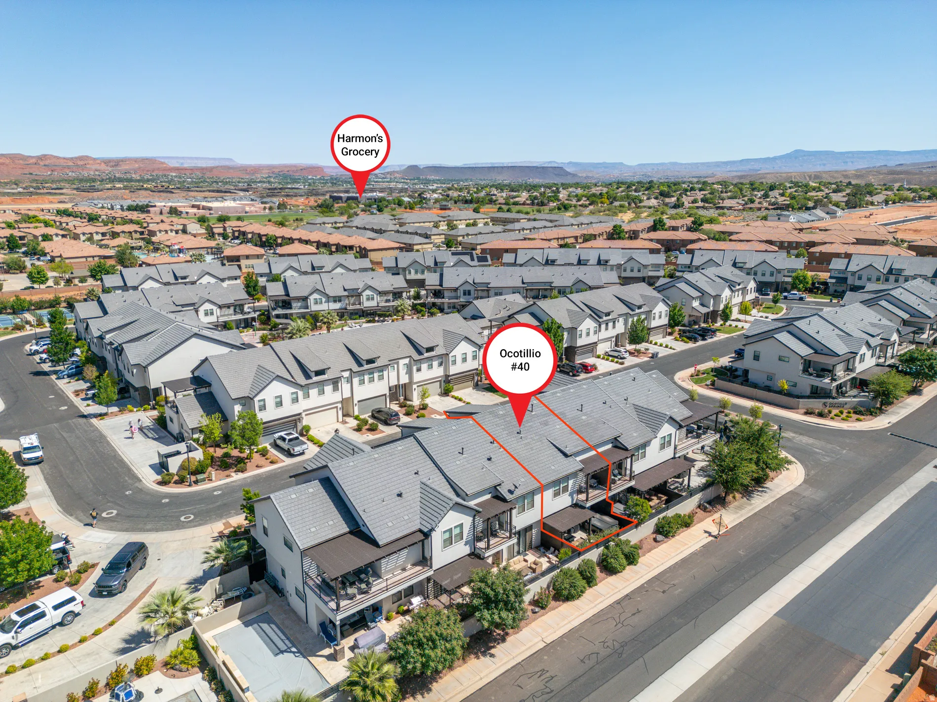 Aerial view of residential area featuring a mountain backdrop
