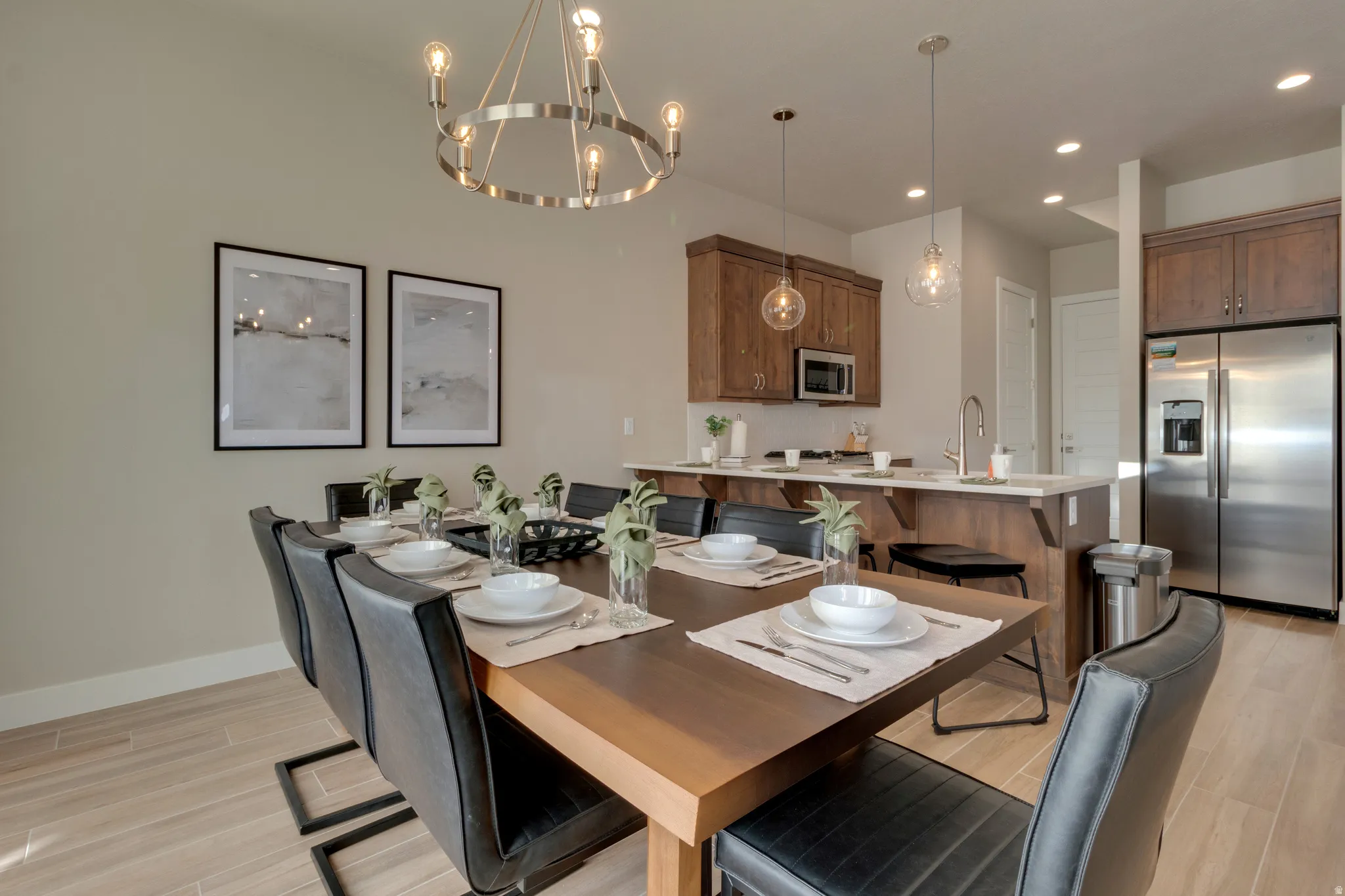 Dining area with wood finish floors and a chandelier