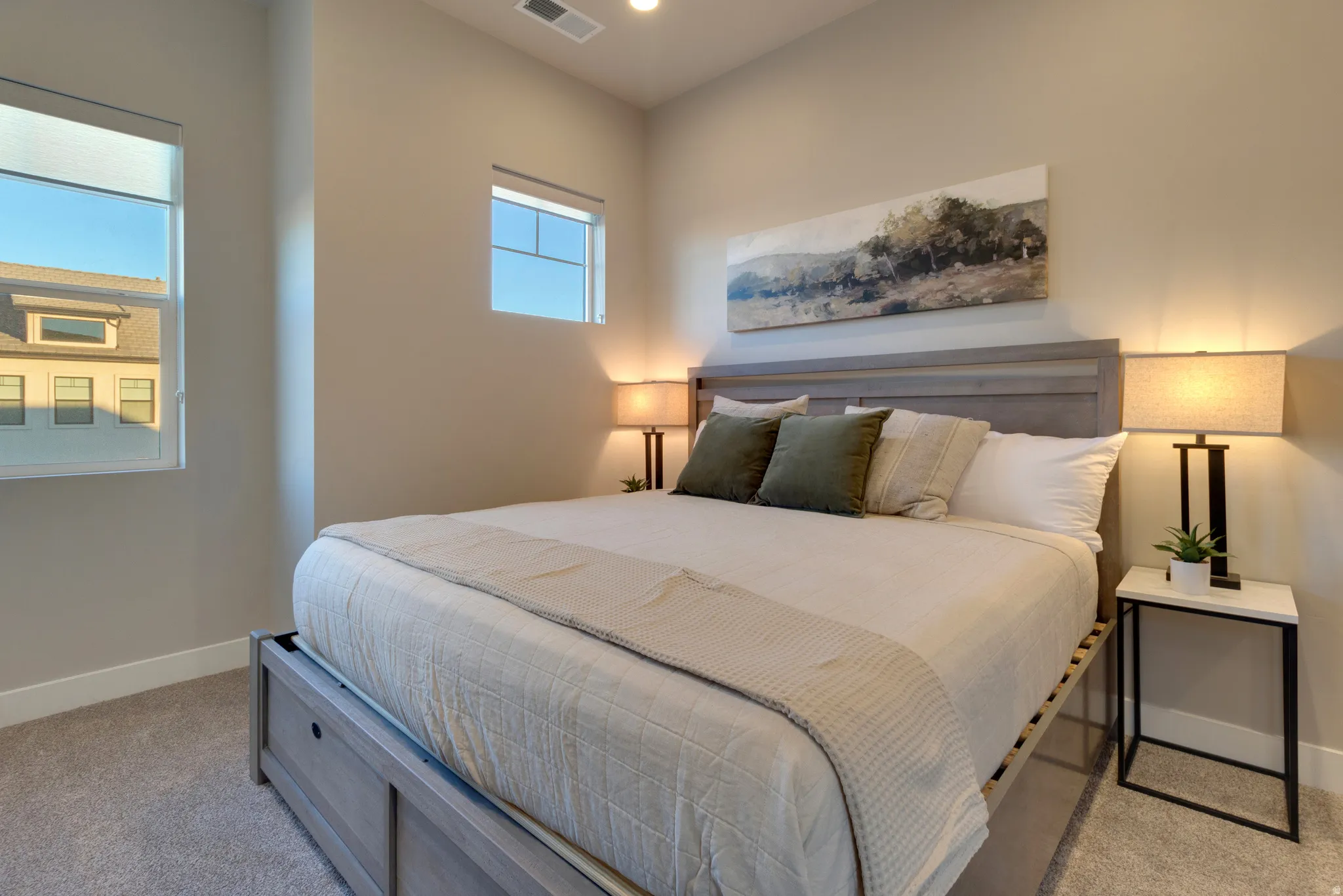 Bedroom with light carpet and recessed lighting