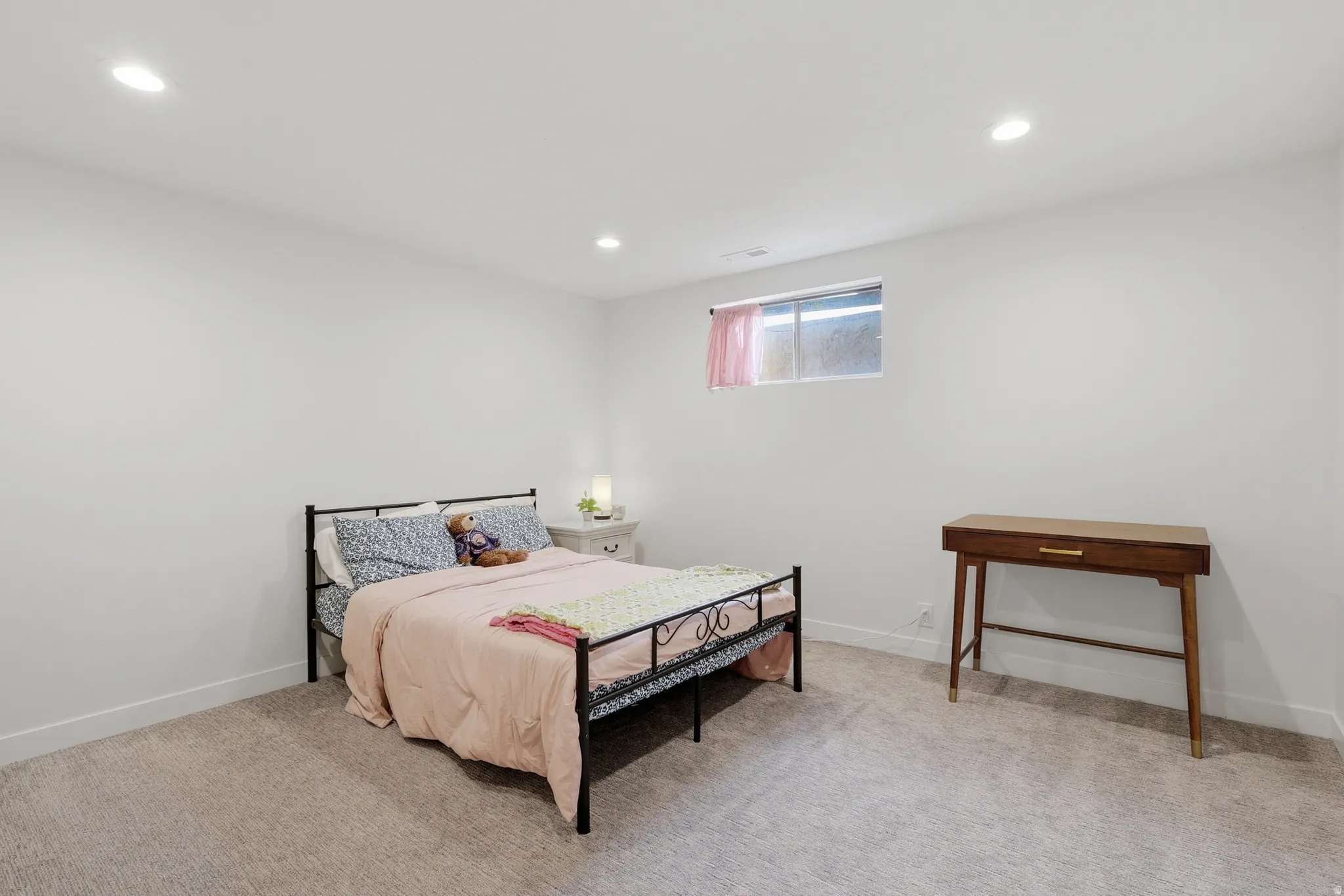 Bedroom featuring light carpet and recessed lighting