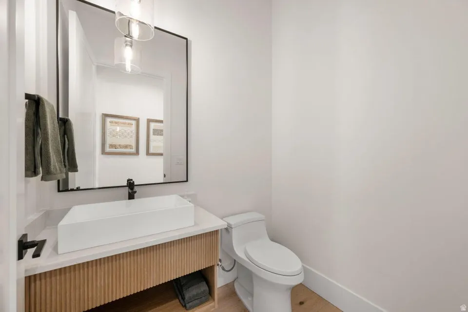 Bathroom featuring vanity and light wood finished floors