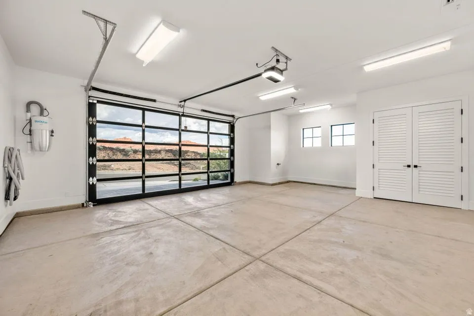 Garage featuring french doors and a garage door opener