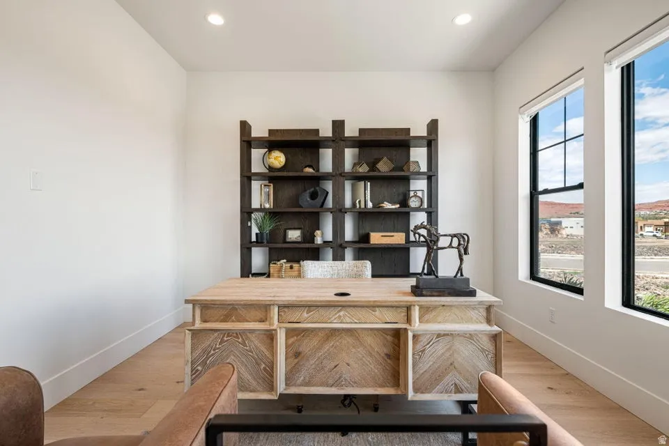 Office featuring light wood finished floors and recessed lighting
