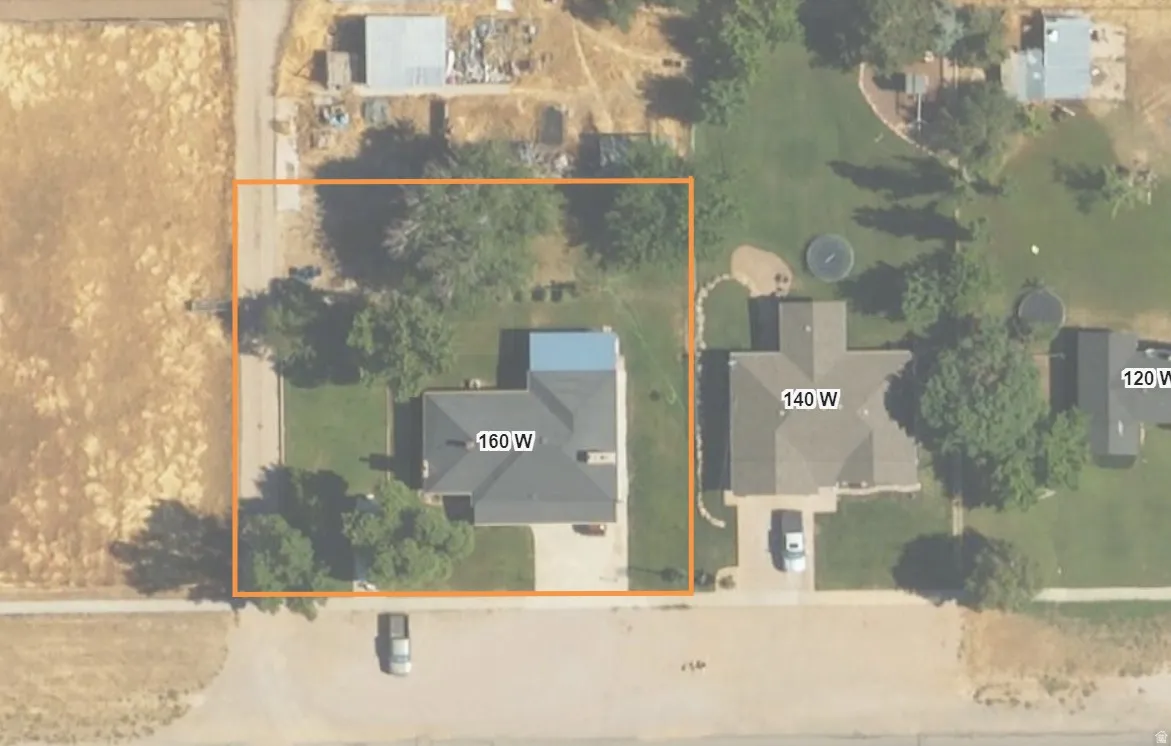 APPROX- Aerial overview of property's location featuring property parcel outlined