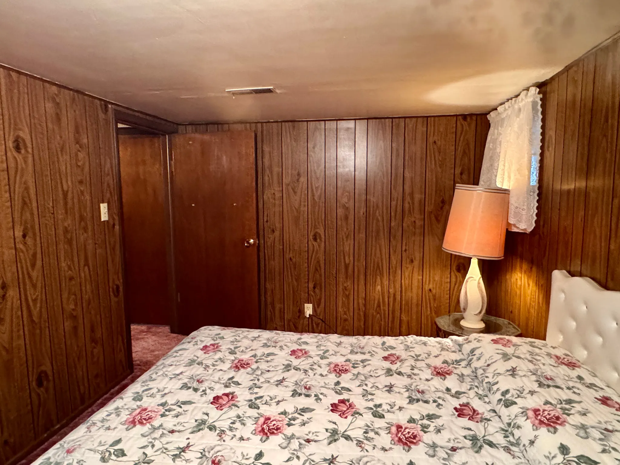Bedroom with wooden walls