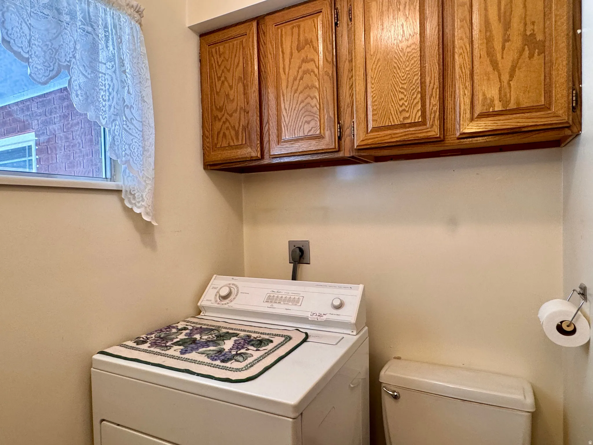 Laundry room with washer / dryer and cabinet space