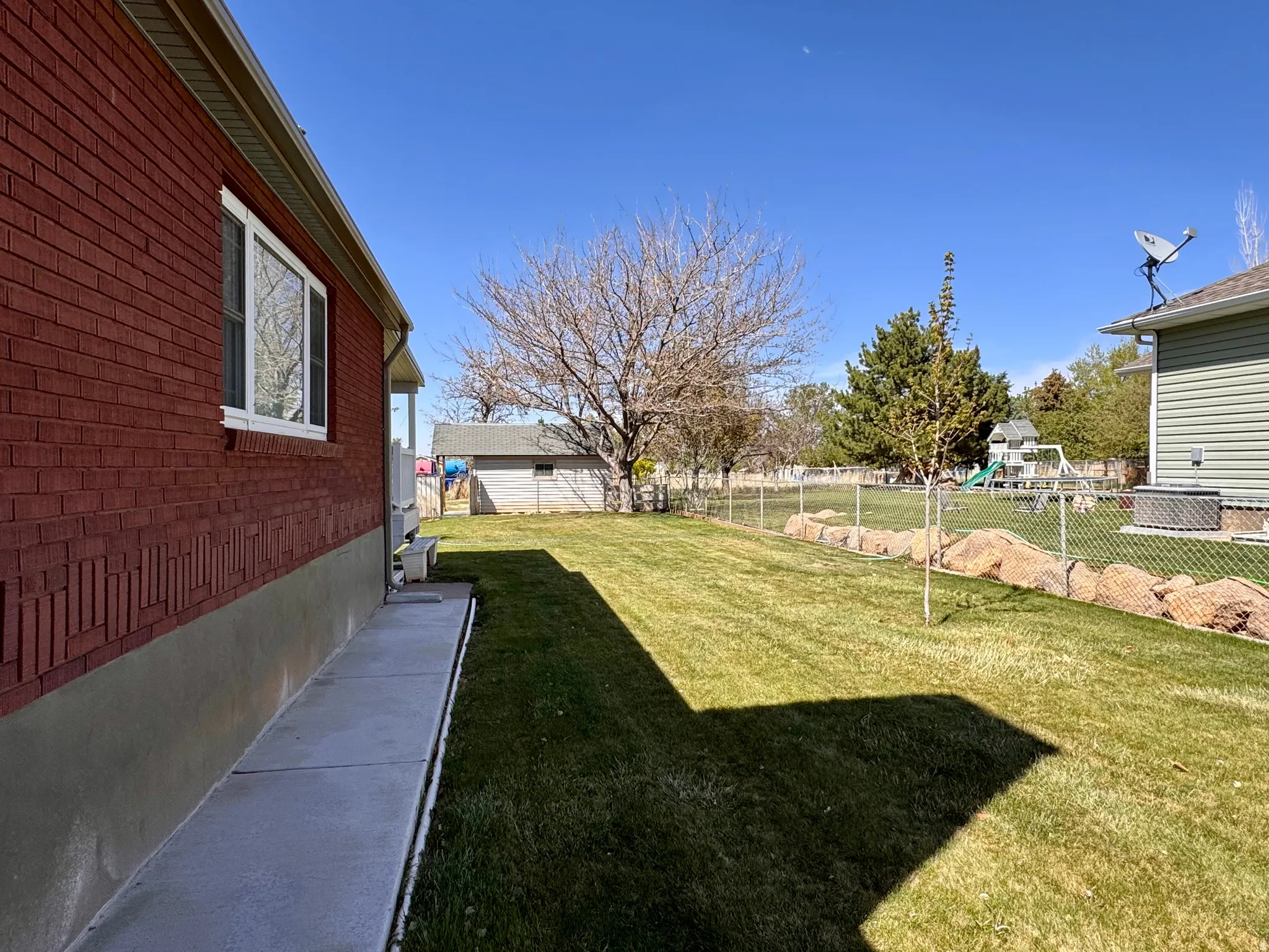 View of fenced backyard
