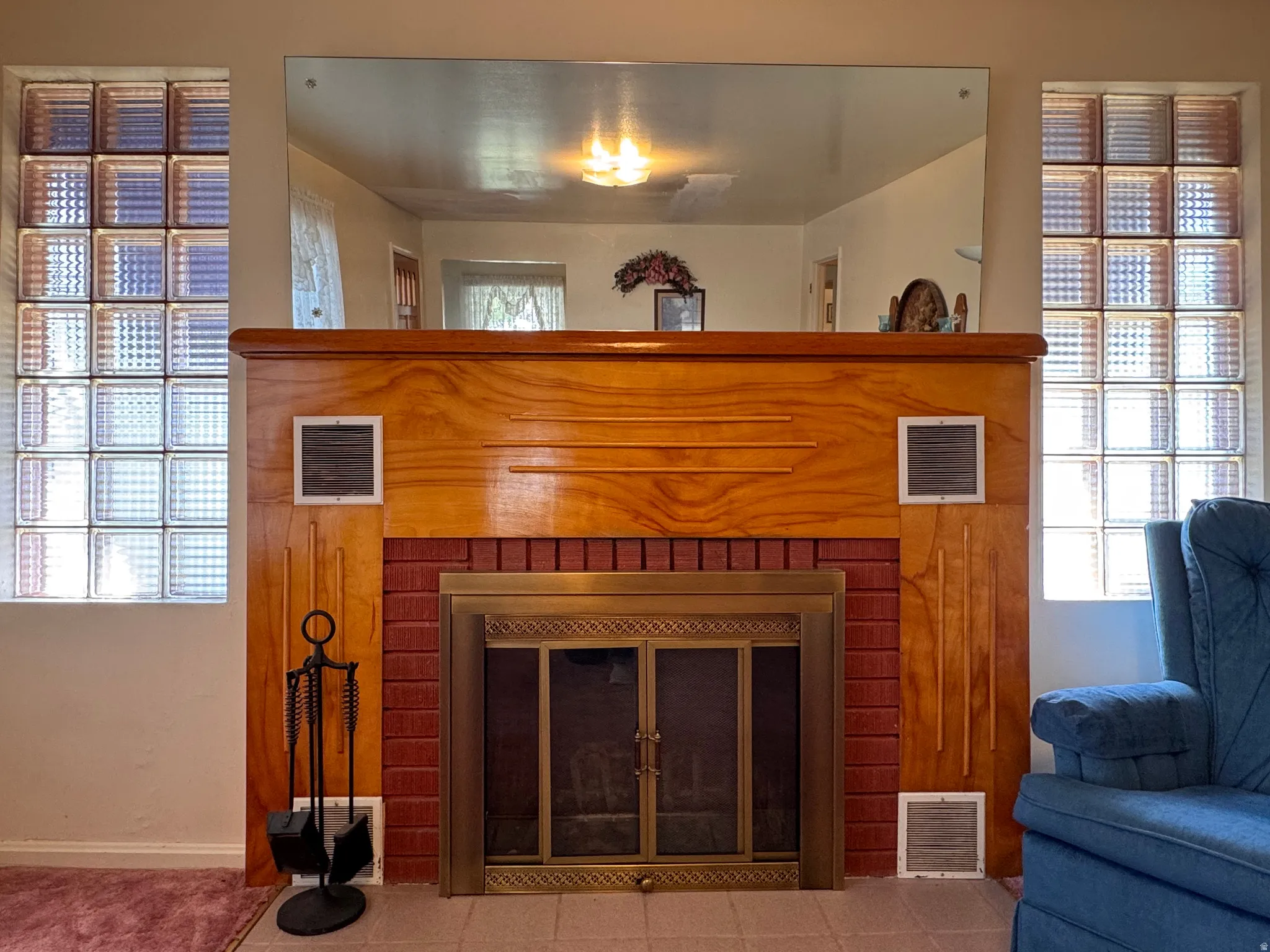 Detailed view of a fireplace and baseboards