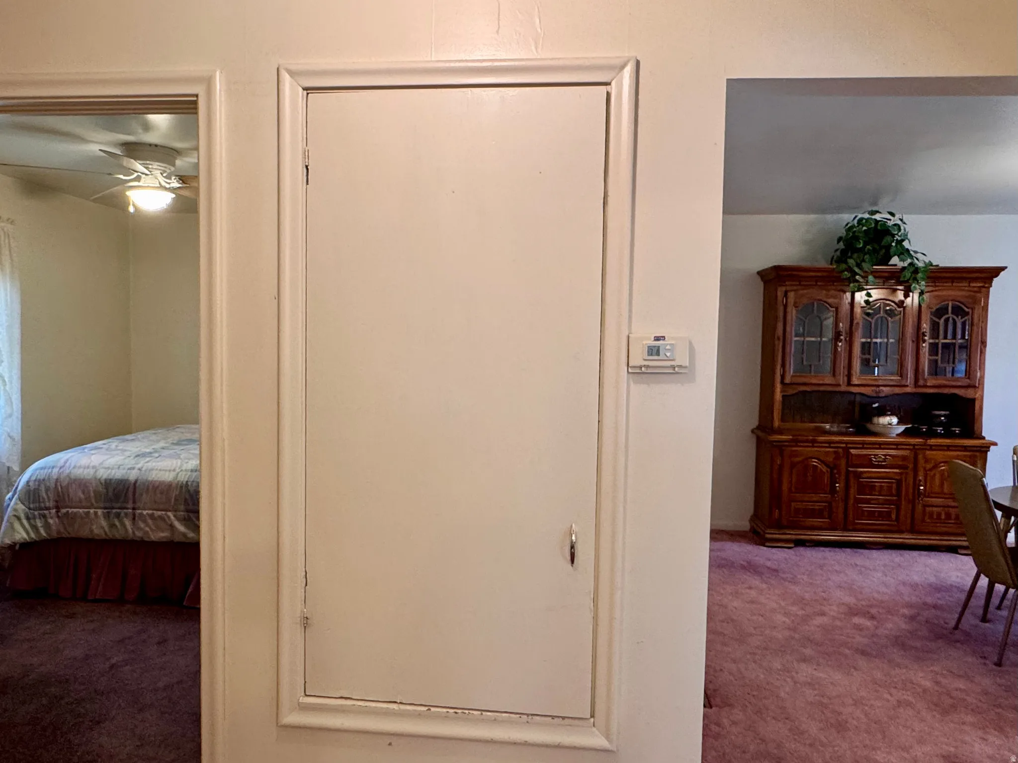 Corridor featuring carpet