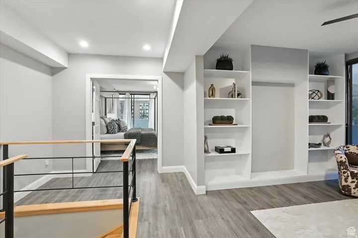 Top of stairs leading to an open office space