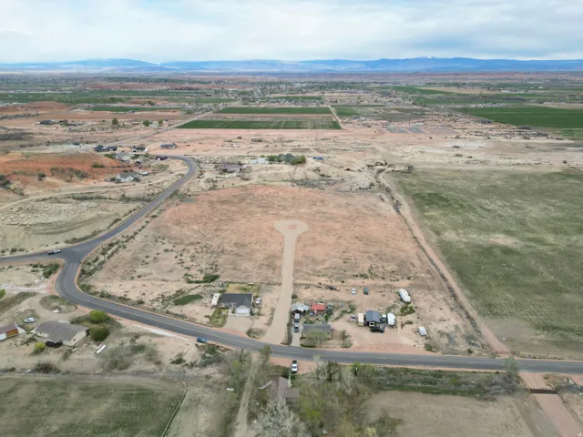 Aerial view of property looking NORTH Lot #2 and surrounding area featuring rural landscape and a mountainous background