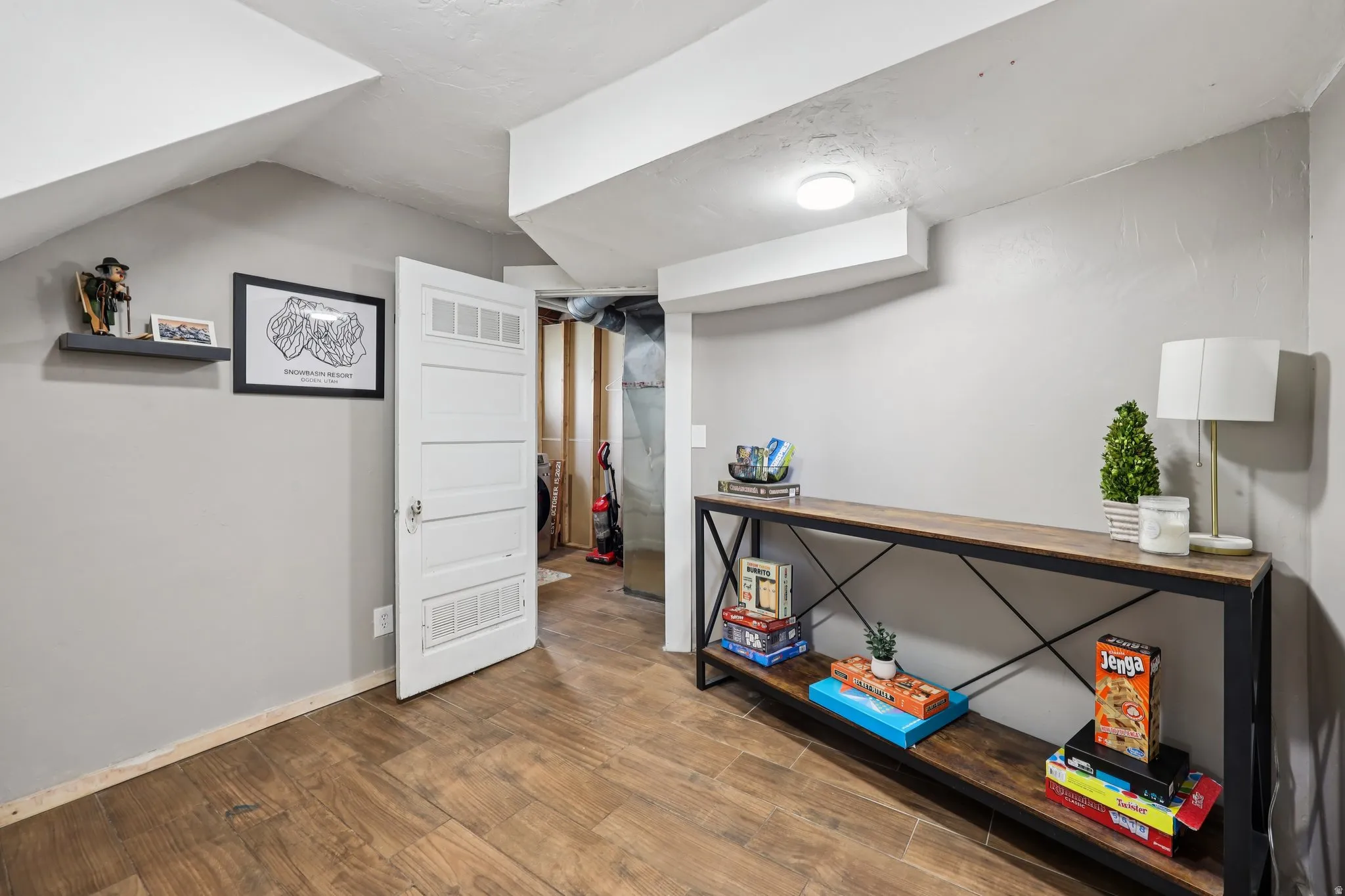 Basement with wood finished floors and baseboards