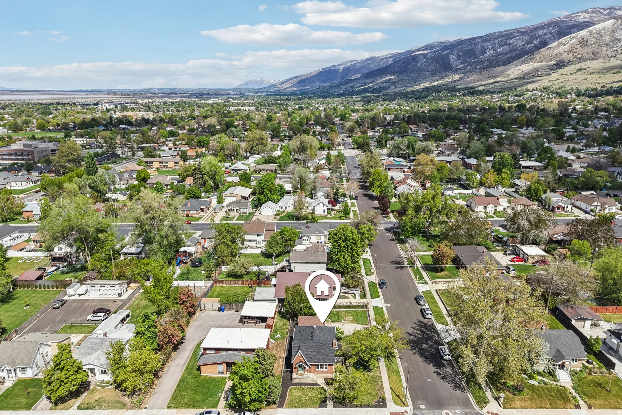 Aerial view of residential area featuring mountains
