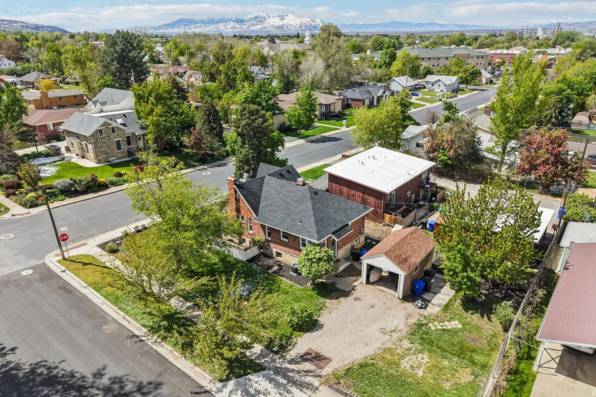 Aerial perspective of suburban area featuring a mountain backdrop
