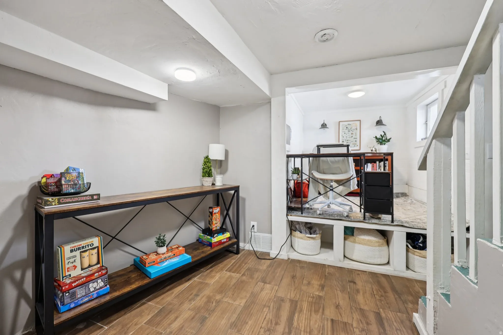 Office space with wood finished floors and baseboards