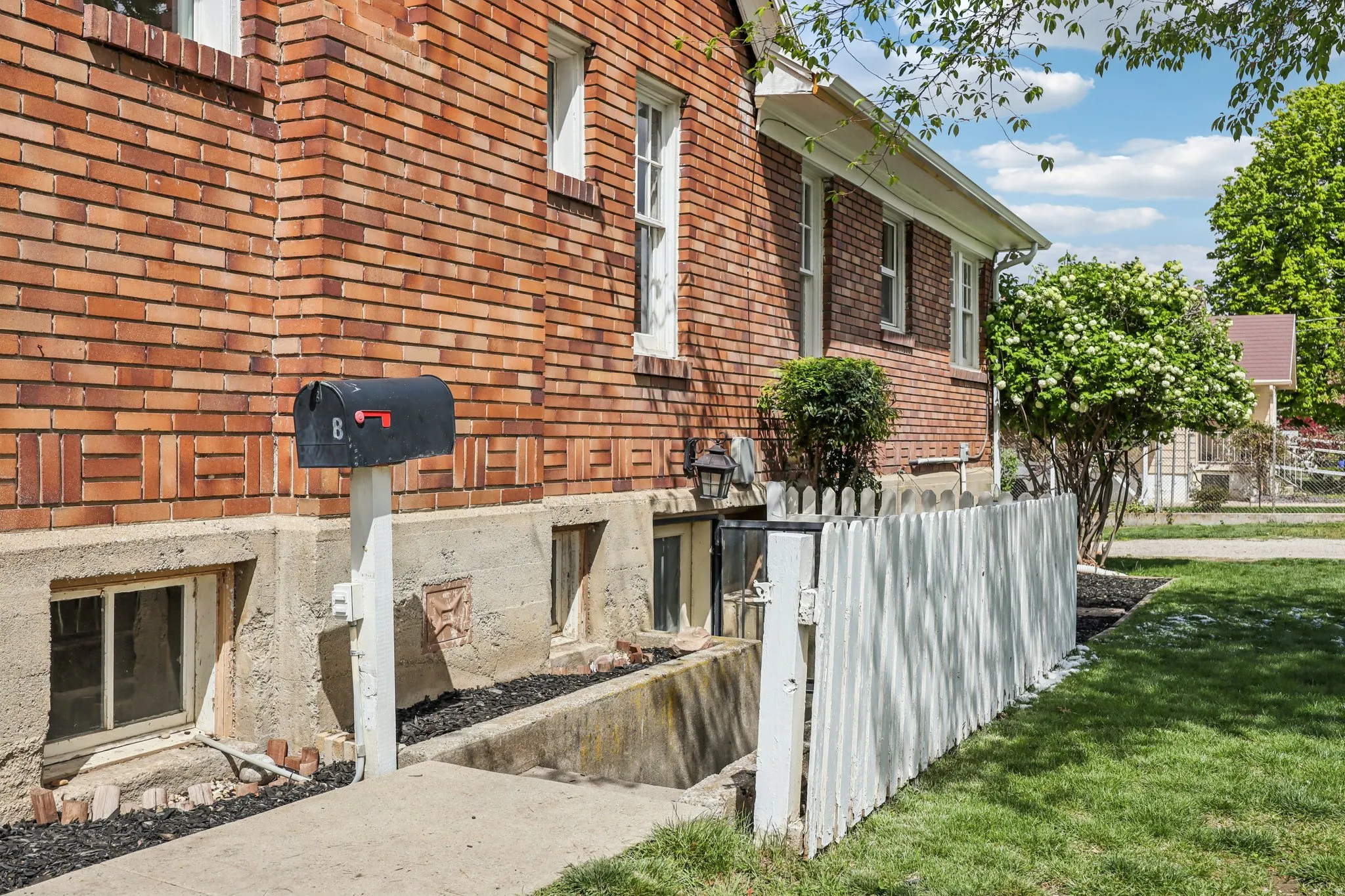 View of side of home featuring brick siding