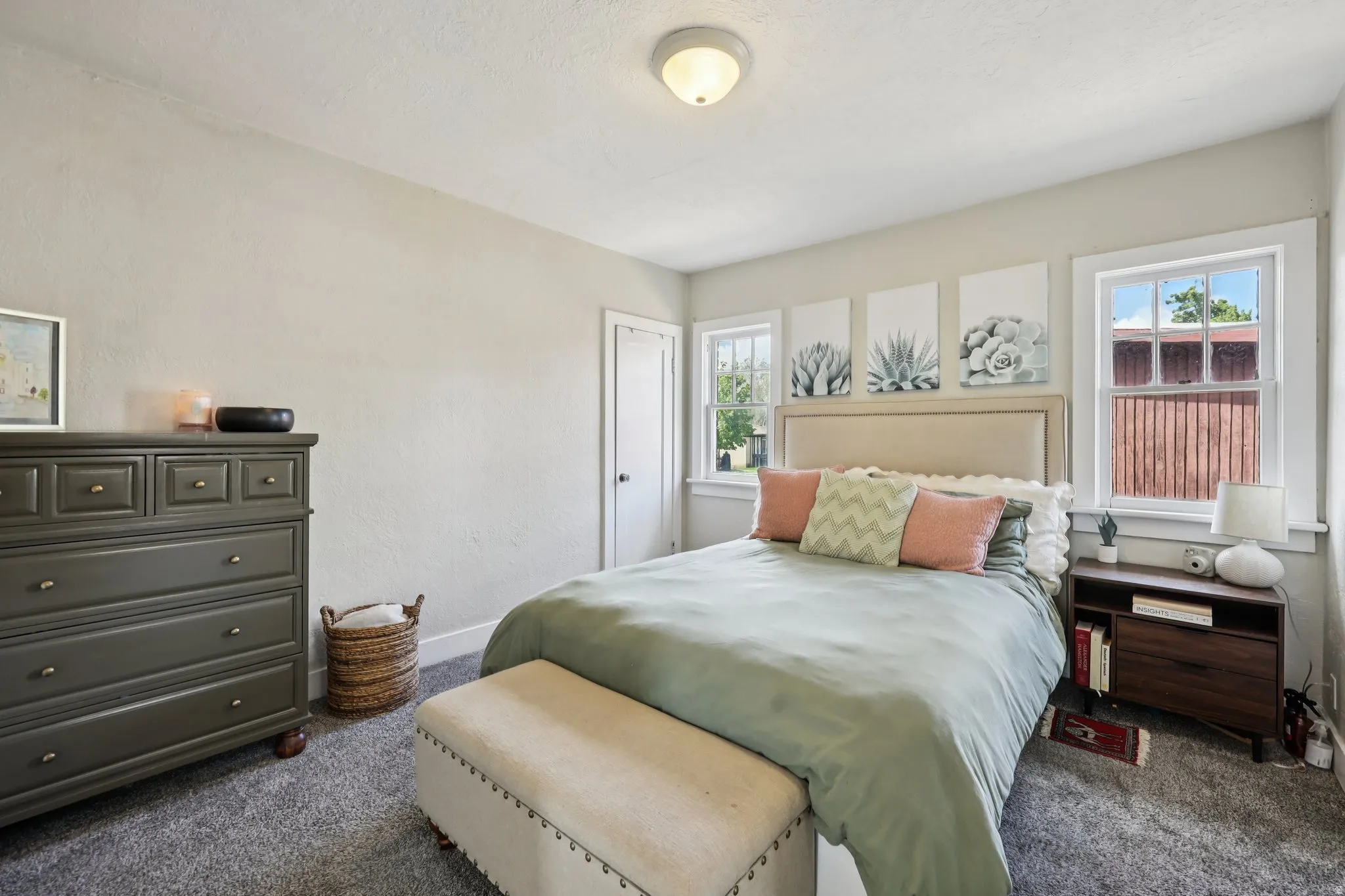 Bedroom featuring dark carpet