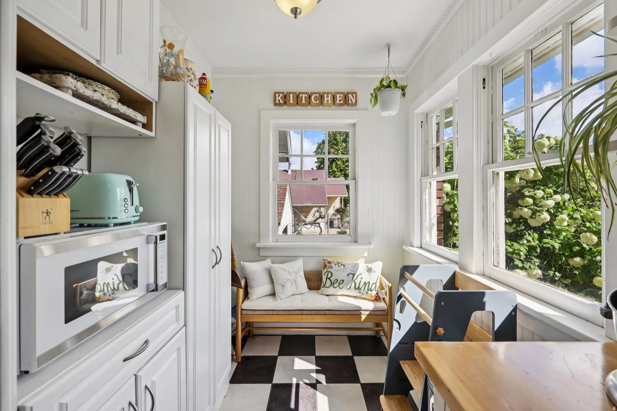 Sitting room featuring dark flooring and ornamental molding