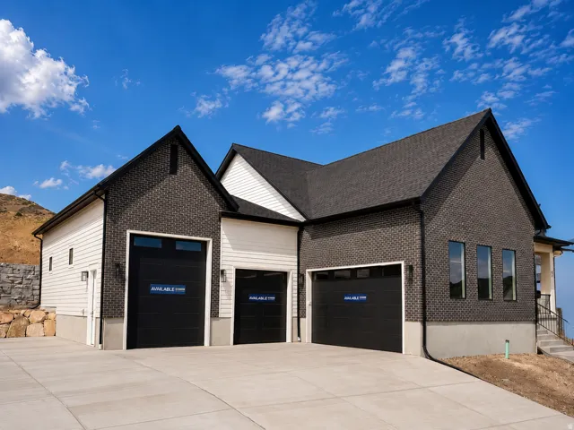 Modern exterior featuring dark brick and light horizontal siding