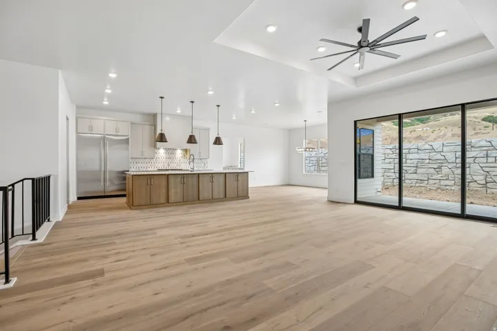 Spacious open-concept layout with wood-finish flooring