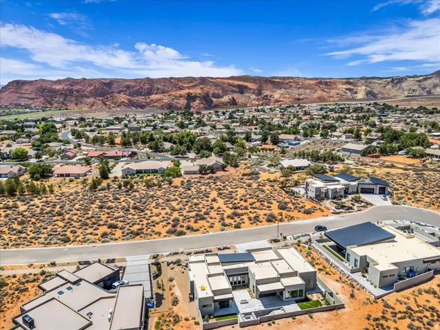 Aerial perspective showcasing a contemporary residential property with a flat roof design
