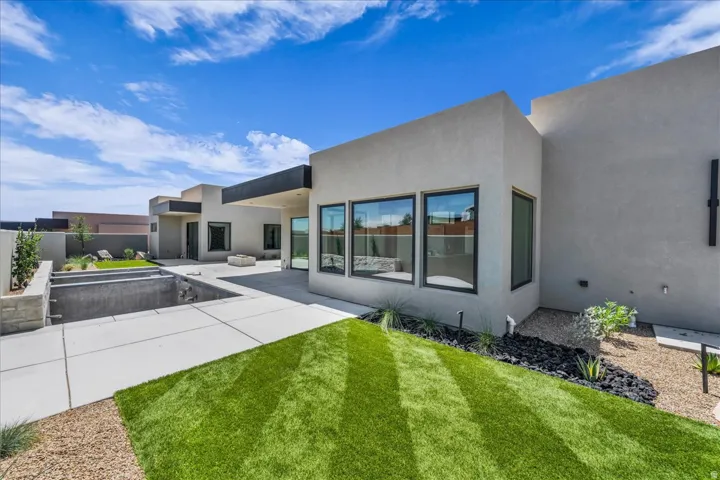 Contemporary exterior with stucco finish and large windows