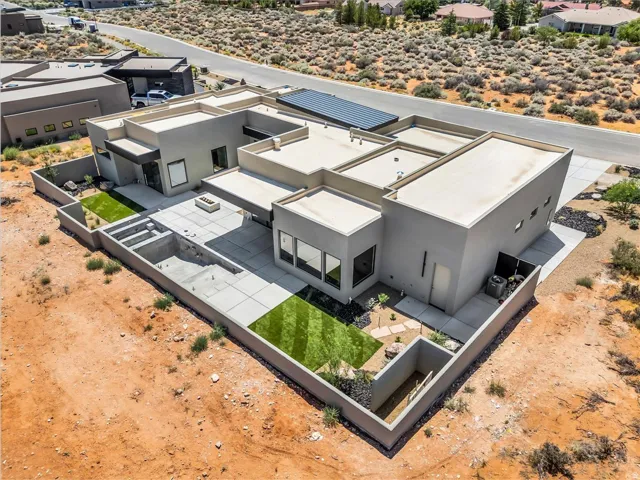 Contemporary stucco exterior with a flat roofline