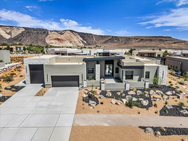 Contemporary architecture featuring a flat roofline and stucco exterior