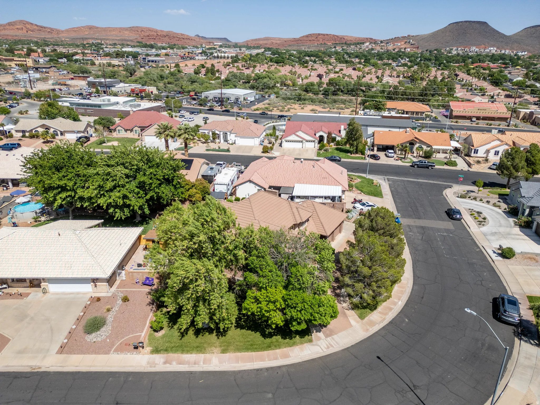 Aerial perspective showcasing residential properties with surrounding hills