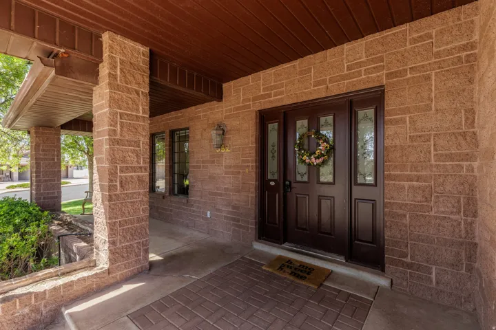Stone veneer exterior with a covered entry
