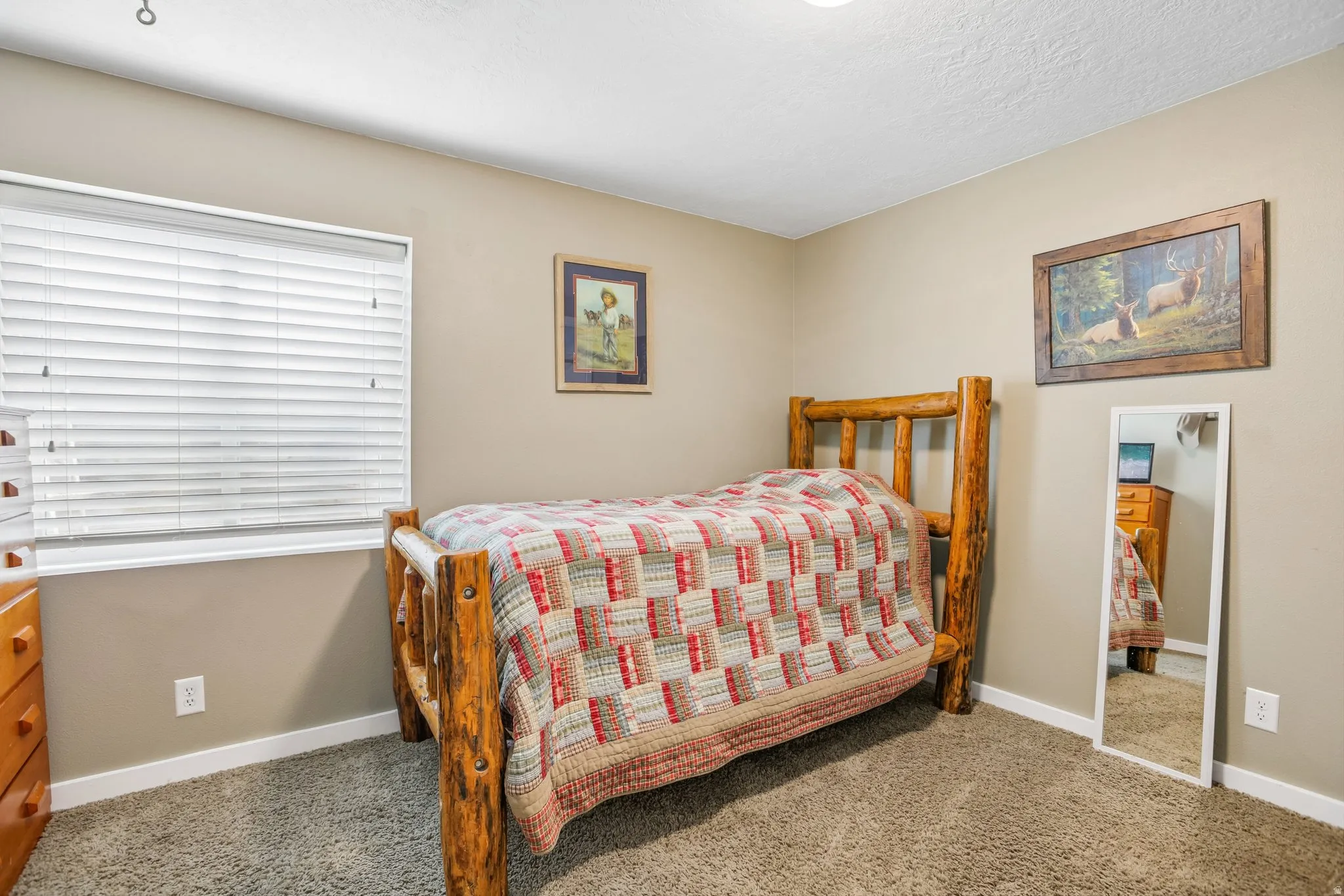 Carpeted bedroom with baseboards